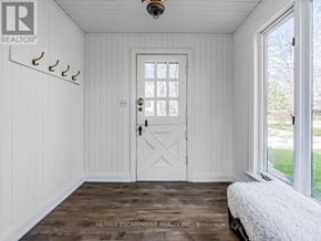 Burlington (Lasalle) apartment for rent - A white door with a window above it in a room with white walls.