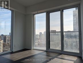 Toronto (Church-Yonge Corridor) condo for rent - A room with a view of the city through large windows.