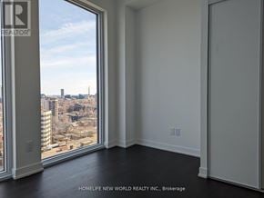 Toronto (Church-Yonge Corridor) condo for rent - A room with a view of the city through a large window.