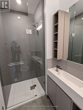 Toronto (Church-Yonge Corridor) condo for rent - A man is taking a picture of a modern bathroom.