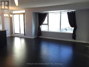 Toronto (Bendale) condo for rent - A room with a large window and black curtains.