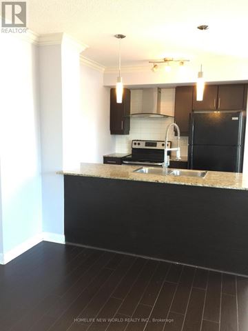 Toronto (Bendale) condo for rent - A modern kitchen with black cabinets and a black refrigerator.