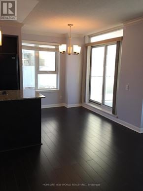 Toronto (Bendale) condo for rent - A black tiled floor in a room with a window and a door.