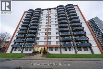 Toronto (Weston) condo for rent - A tall residential building with balconies on each floor.