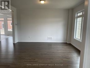Caledon apartment for rent - A room with wooden flooring and white walls.