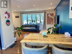 Quinte West (Trenton Ward) apartment for rent - A dining area with a wooden table and chairs.