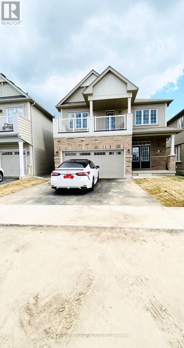 Brantford apartment for rent - A white car is parked in front of a two-story house.