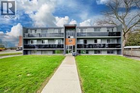 Cambridge apartment for rent - A building with a lawn in front and a REALTOR sign in the corner.