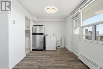 Toronto (Tam O'shanter-Sullivan) condo for rent - A kitchen with a stainless steel dishwasher and a white dishwasher.