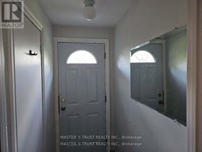 Toronto (Don Valley Village) apartment for rent - A white door with a window above it in a hallway.