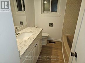 Toronto (Don Valley Village) apartment for rent - A bathroom with a sink, toilet, and bathtub.