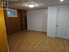 Toronto (Don Valley Village) apartment for rent - A room with wooden floors and a white door.