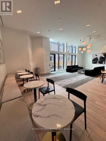 Toronto (Junction Area) condo for rent - A modern living room with a dining table and chairs.