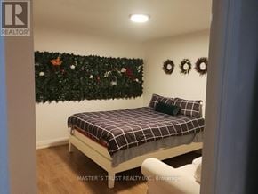 Toronto (Church-Yonge Corridor) condo for rent - A bedroom with a bed and a wall decorated with Christmas decorations.