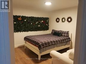 Toronto (Church-Yonge Corridor) condo for rent - A bedroom with a bed and a wall decorated with Christmas decorations.
