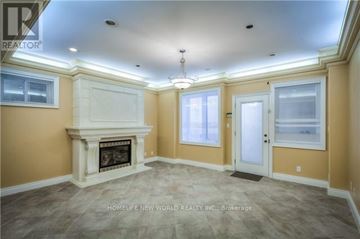 Toronto (Newtonbrook East) apartment for rent - A living room with a fireplace and a chandelier.