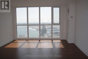 Toronto (Waterfront Communities) condo for rent - A room with a view of the city and water.