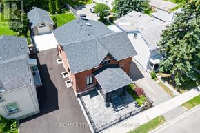 Brampton (Downtown Brampton) apartment for rent - A bird's eye view of a house with a red brick exterior and a grey roof.