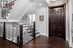 Brampton (Downtown Brampton) apartment for rent - A brown door is in a white hallway.