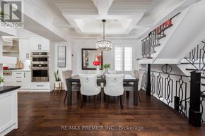 Brampton (Downtown Brampton) apartment for rent - A dining room with a table set for four and a kitchen area in the background.