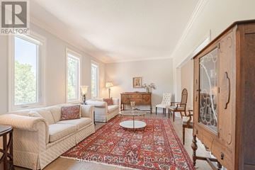 Vaughan (East Woodbridge) apartment for rent - A living room with a rug and a wooden cabinet.