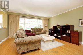 Toronto (Woburn) apartment for rent - A living room with a couch, a coffee table, and a bookshelf.
