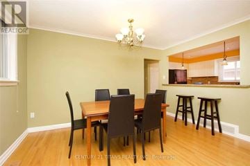 Toronto (Woburn) apartment for rent - A dining room with a wooden table and chairs.