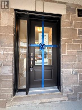 Kitchener townhouse for rent - A door with a blue ribbon tied around it.
