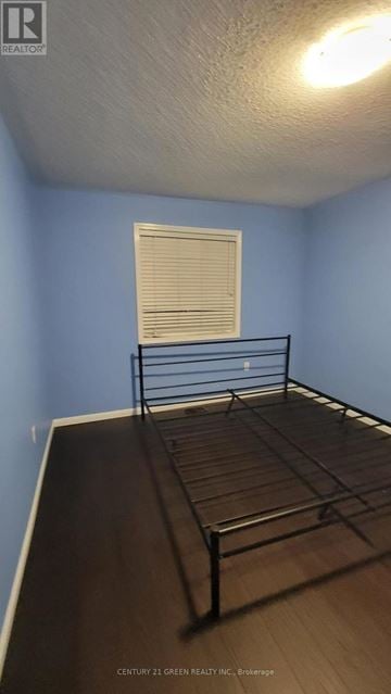Brampton (Credit Valley) apartment for rent - A bedroom with a bed and a window with blinds.