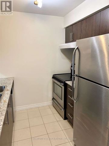 Toronto (Bendale) condo for rent - A kitchen with a stainless steel refrigerator and a sink.