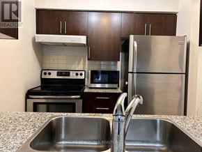Toronto (Bendale) condo for rent - A kitchen with a sink, stove, and refrigerator.
