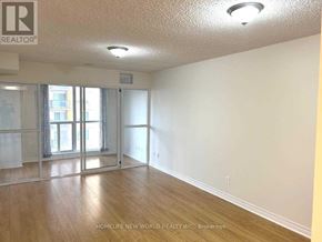Toronto (Bendale) condo for rent - A room with a sliding glass door and wooden flooring.