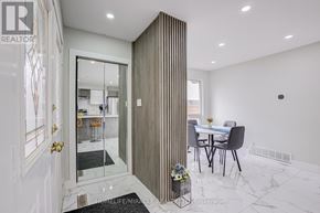 Oshawa (Samac) apartment for rent - A modern kitchen with a dining area and a sliding door.