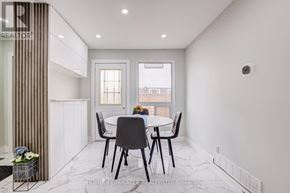 Oshawa (Samac) apartment for rent - A dining room with a table set for four.