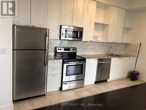 Toronto (Church-Yonge Corridor) condo for rent - A kitchen with a stainless steel refrigerator, microwave, oven, and dishwasher.