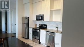 Toronto (Church-Yonge Corridor) condo for rent - A kitchen with a refrigerator, oven, and microwave.