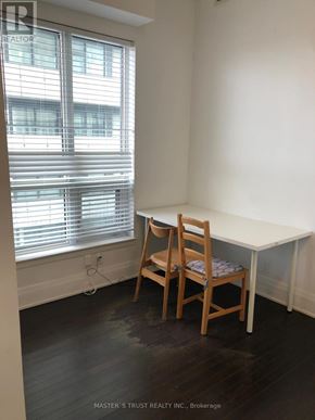 Toronto (Church-Yonge Corridor) condo for rent - A room with a table and chairs by a window.