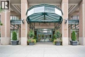 Toronto (Bay Street Corridor) condo for rent - The entrance to a building with a glass roof and pillars on either side.