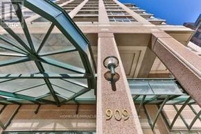 Toronto (Bay Street Corridor) condo for rent - A building with a glass roof and a sign that reads "900".