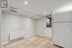 Toronto (Lawrence Park North) apartment for rent - A white room with a door and a radiator on the floor.