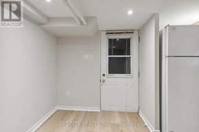 Toronto (Lawrence Park North) apartment for rent - A white door with a window is in a room with white walls.