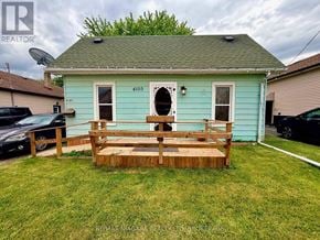 Niagara Falls (Downtown) apartment for rent - A blue house with a wooden deck in front.