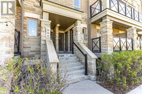 Markham (Cornell) townhouse for rent - A stone building with a staircase leading to the entrance.