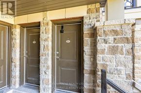 Markham (Cornell) townhouse for rent - Three doors are in a stone wall.