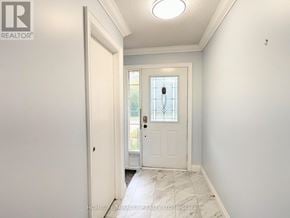 Whitby (Pringle Creek) townhouse for rent - A hallway with a white door and a window.