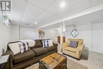 Whitby (Pringle Creek) townhouse for rent - A living room with a brown couch and a wooden coffee table.