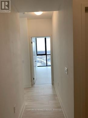 Vaughan (Concord) condo for rent - A hallway with a door leading to a balcony.