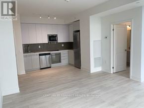 Vaughan (Concord) condo for rent - A kitchen with white cabinets and a grey countertop.