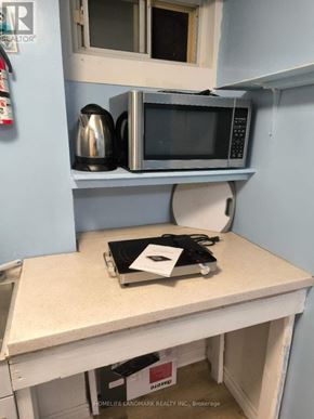 Richmond Hill (Crosby) apartment for rent - A kitchen with a microwave, kettle, and toaster on a counter.