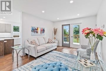 London South (South E) apartment for rent - A living room with a couch, a coffee table, and a painting on the wall.